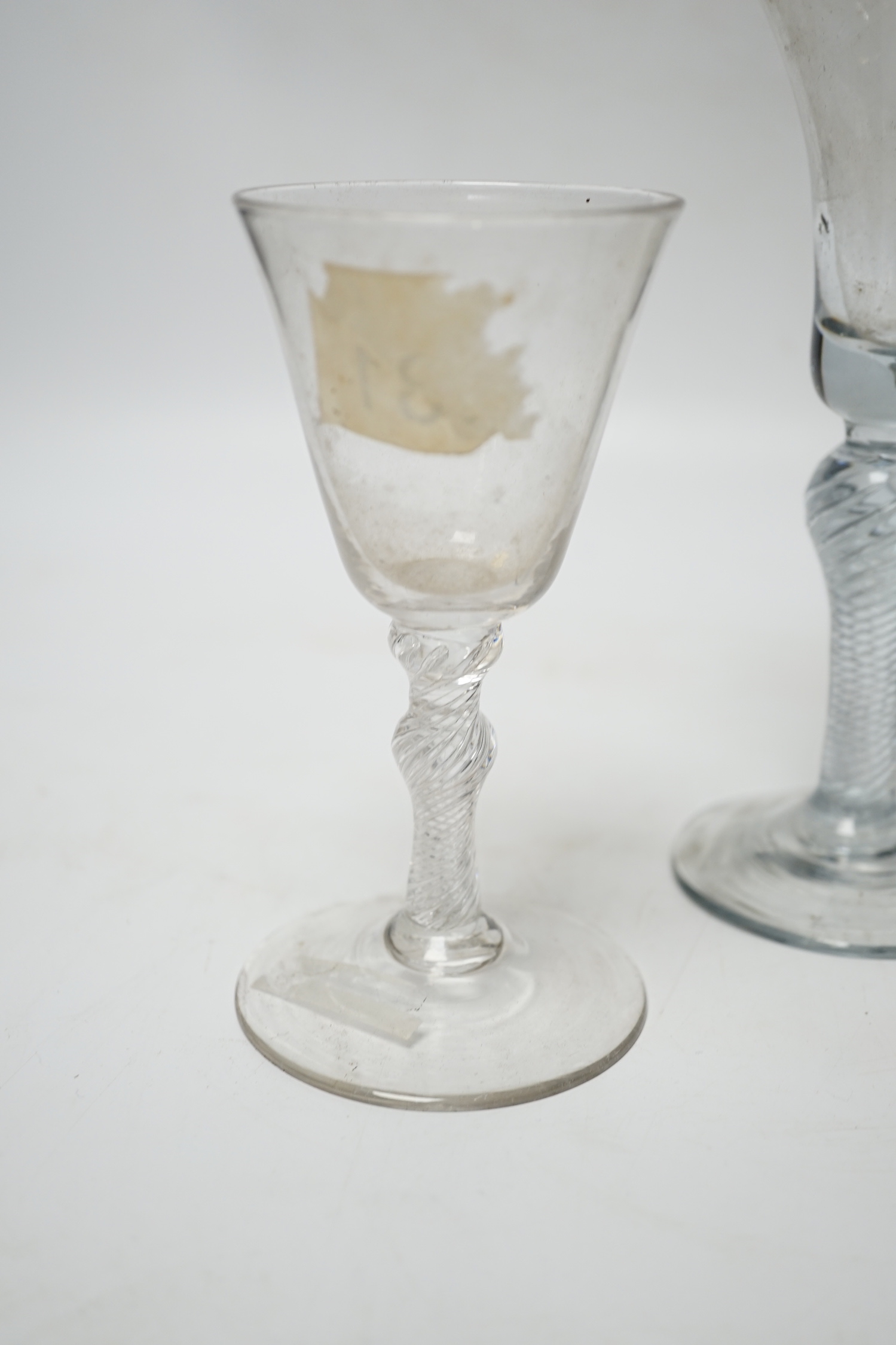 Three 18th century air twist stemmed wine glasses, tallest 16.5cm high